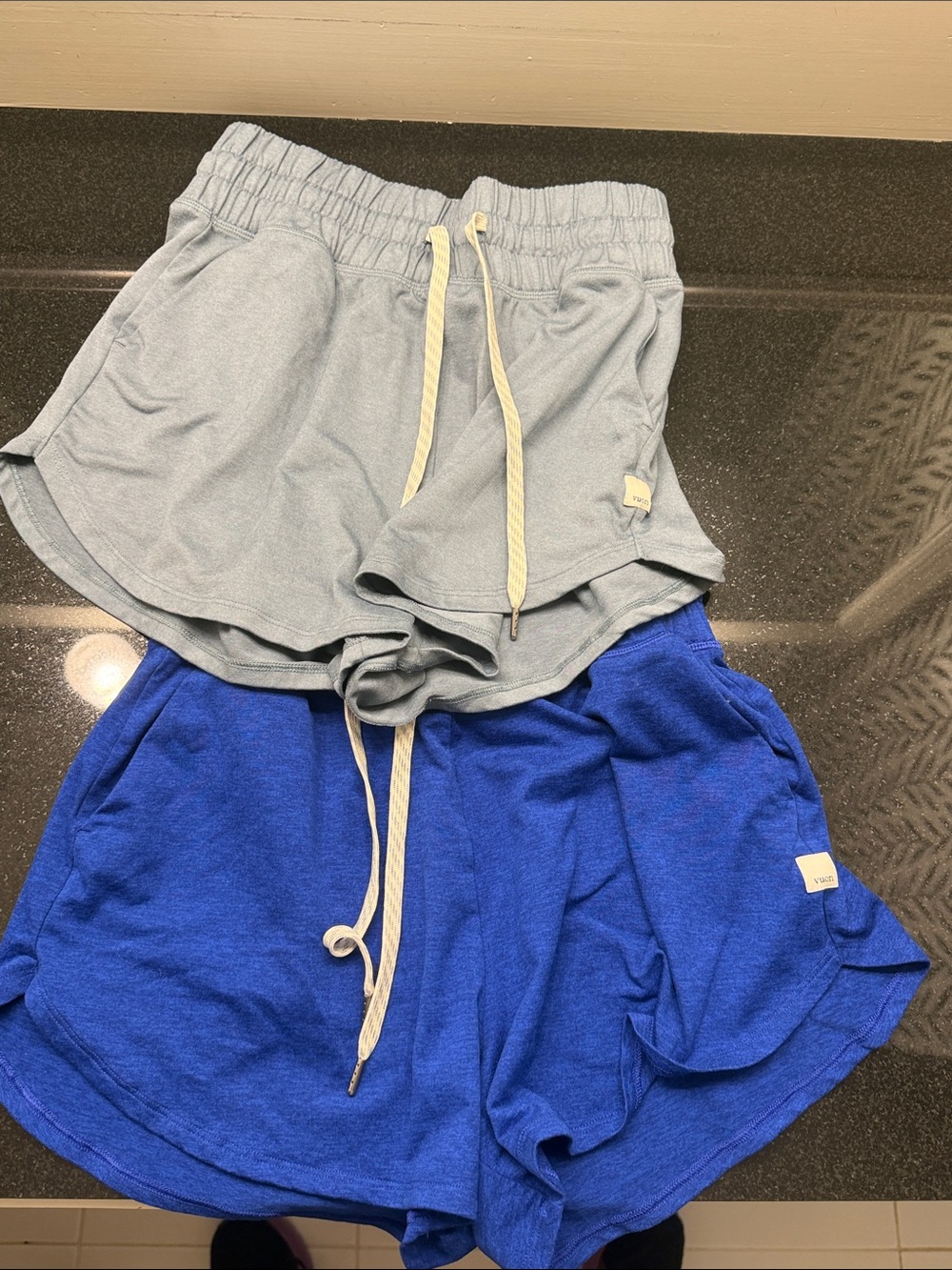 Women’s two pair Vuori Drawstring Shorts in Light Gray & Royal Blue